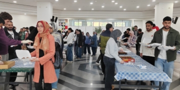 “علشانك يا بلدي” بالجامعة الألمانية تطلق مبادرة توزيع ملابس العيد للأسر المحتاجة